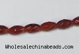 CAA124 15.5 inches 6*10mm faceted rice red agate gemstone beads