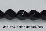 CAB336 15.5 inches 10*14mm faceted & twisted rice black agate beads