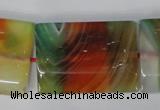 CAG1057 15.5 inches 25*35mm flat tube rainbow agate beads