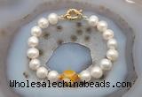 CFB1037 Hand-knotted 9mm - 10mm potato white freshwater pearl & yellow banded agate bracelet