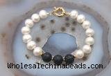 CFB1080 Hand-knotted 9mm - 10mm potato white freshwater pearl & black lava bracelet