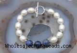 CFB930 Hand-knotted 9mm - 10mm rice white freshwater pearl & sodalite bracelet