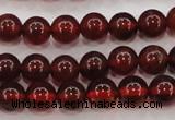 CGA601 15.5 inches 6mm A grade round natural orange garnet beads