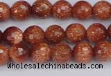 CGS471 15.5 inches 6mm faceted round goldstone beads wholesale