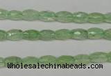 CRU165 15.5 inches 5*8mm faceted rice green rutilated quartz beads