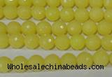 CTU2523 15.5 inches 4mm faceted round synthetic turquoise beads