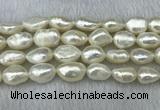 FWP304 15 inches 11mm - 12mm baroque white freshwater pearl strands